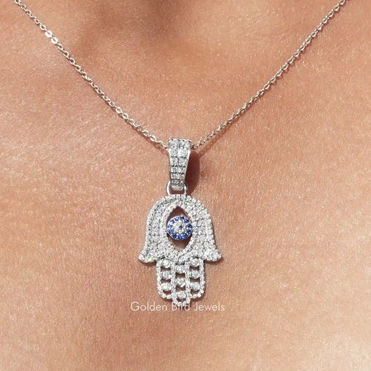 Hamsa hand pendant necklace in silver with blue evil eye and clear round stones