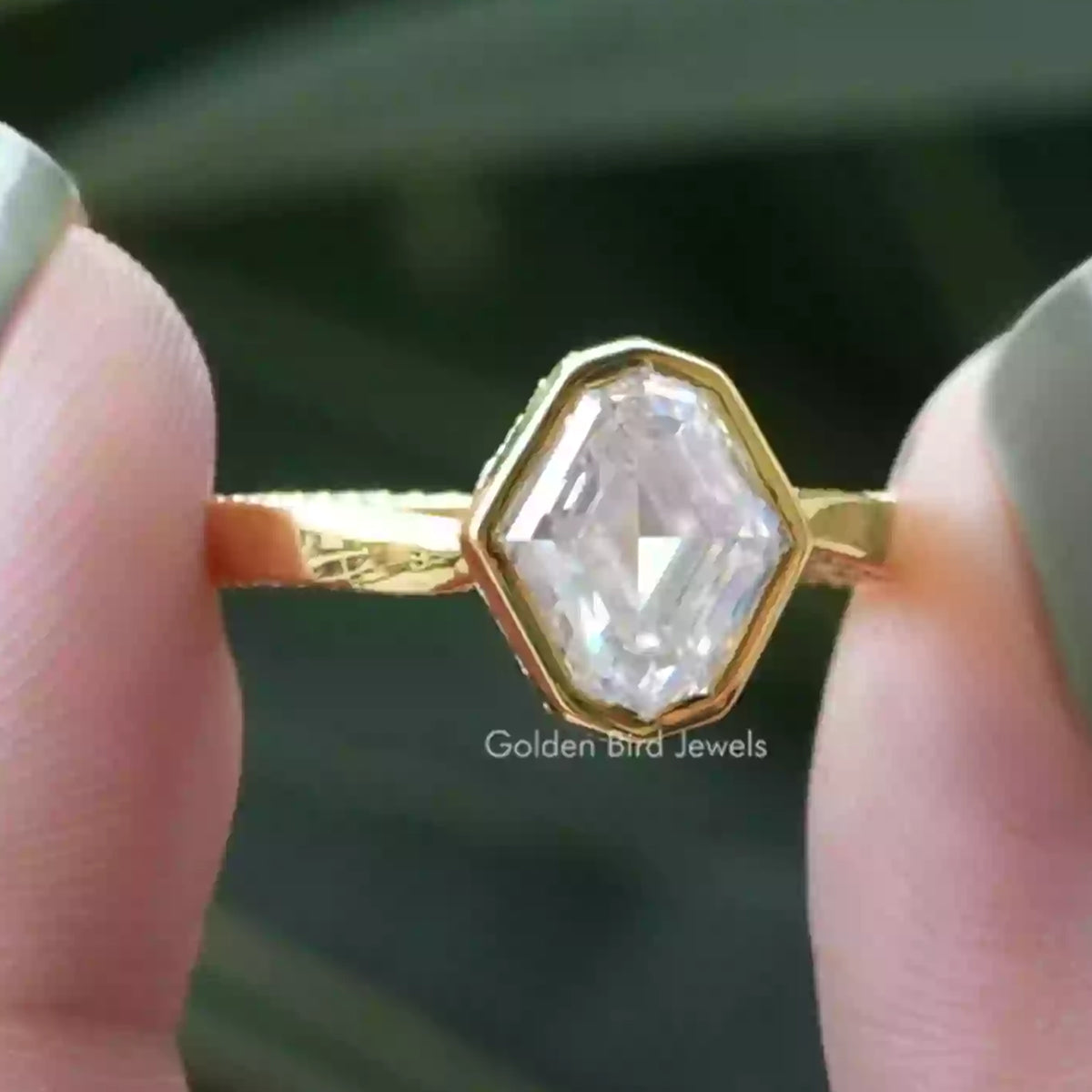 Gold ring with prong-set octagonal clear gemstone