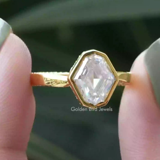Gold ring with prong-set octagonal clear gemstone