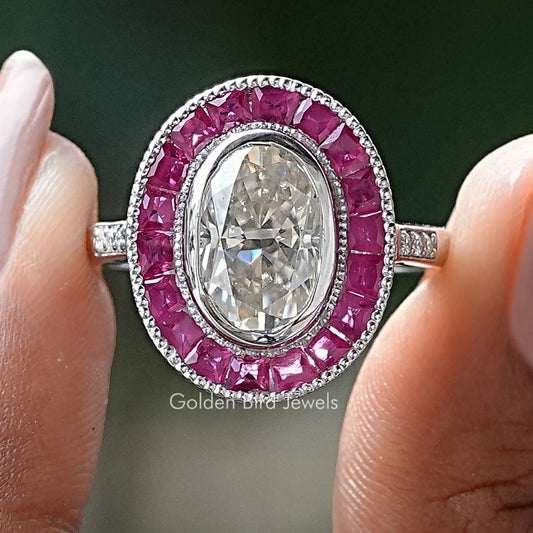 Oval moissanite halo engagement ring with pink gemstone frame, silver band