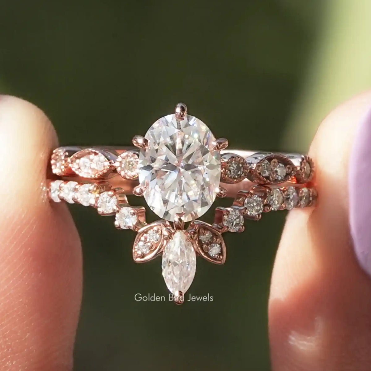 Oval moissanite bridal ring with chevron band and pavé accents