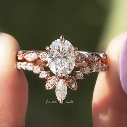 Oval moissanite bridal ring with chevron band and pavé accents