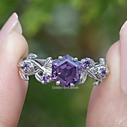 Purple amethyst hexagon cut engagement ring with silver leaf and floral side accents