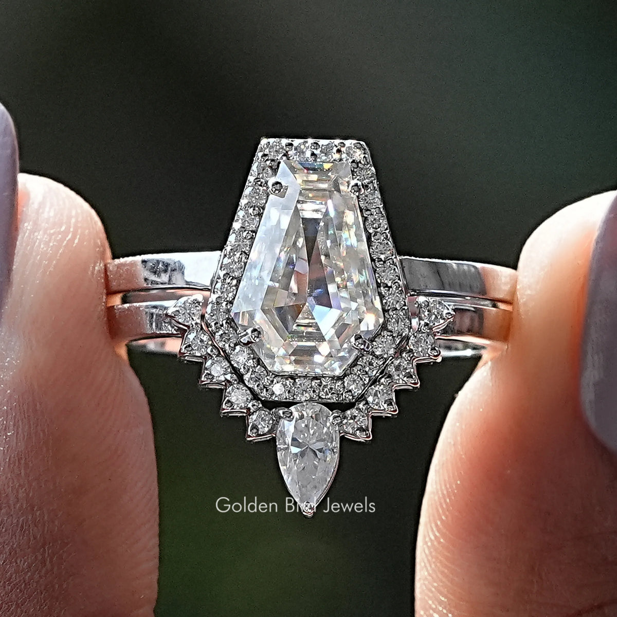 Moissanite halo bridal ring set with oval center stone and baguette accents, silver tone