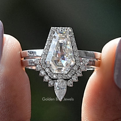 Moissanite halo bridal ring set with oval center stone and baguette accents, silver tone