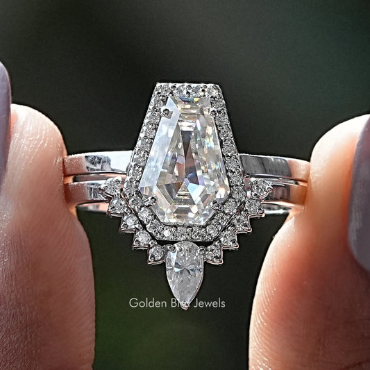 Moissanite halo bridal ring set with oval center stone and baguette accents, silver tone