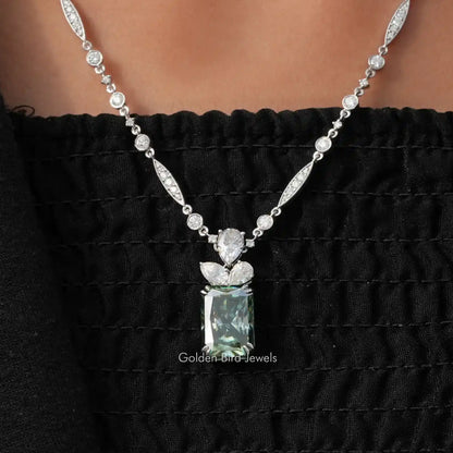 Sterling silver moissanite wedding necklace with oval and round stones, pear-shaped center