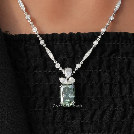 Sterling silver moissanite wedding necklace with oval and round stones, pear-shaped center