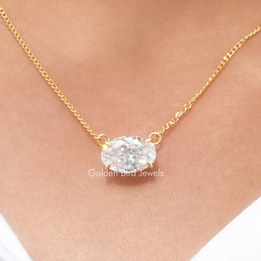 Gold-tone oval moissanite pendant on chain with faceted crushed-ice style setting