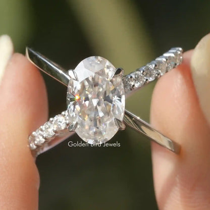 Oval cut moissanite ring with split shank and pavé accents