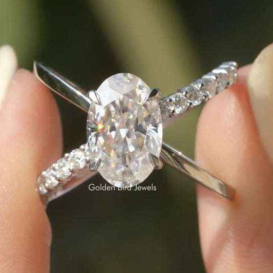 Oval cut moissanite ring with split shank and pavé accents