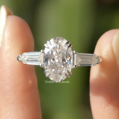 Three-stone moissanite accent ring, round center with baguette side stones in silver