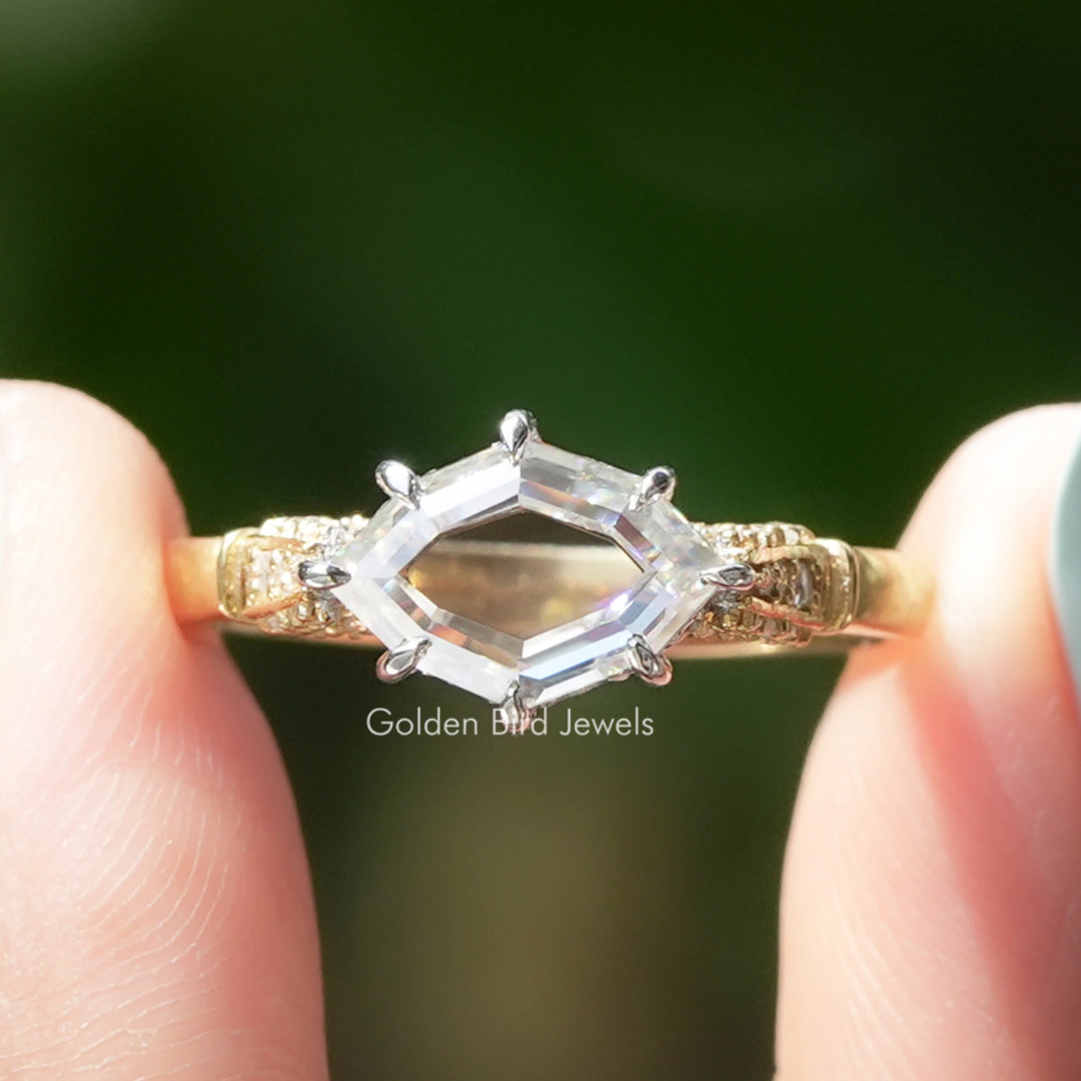 Marquise moissanite ring with hidden halo and engraved gold band