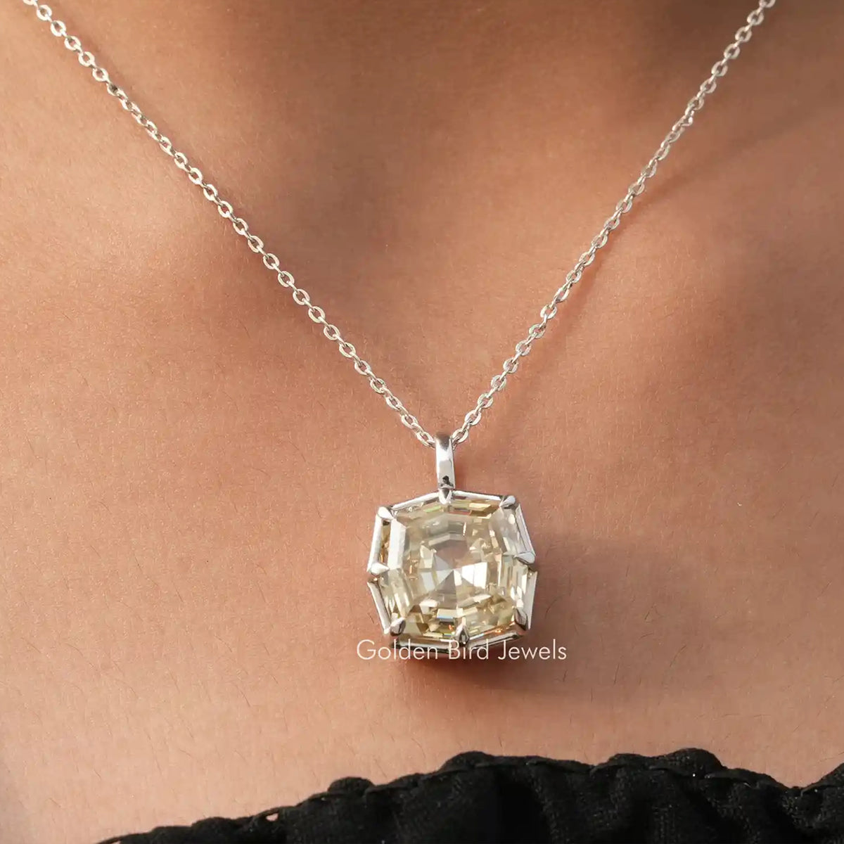 Cushion-cut moissanite solitaire pendant with step-cut setting on silver chain