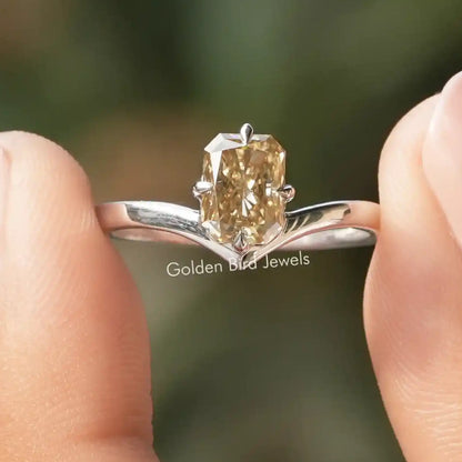 Yellow moissanite solitaire ring with angled prongs and polished silver band