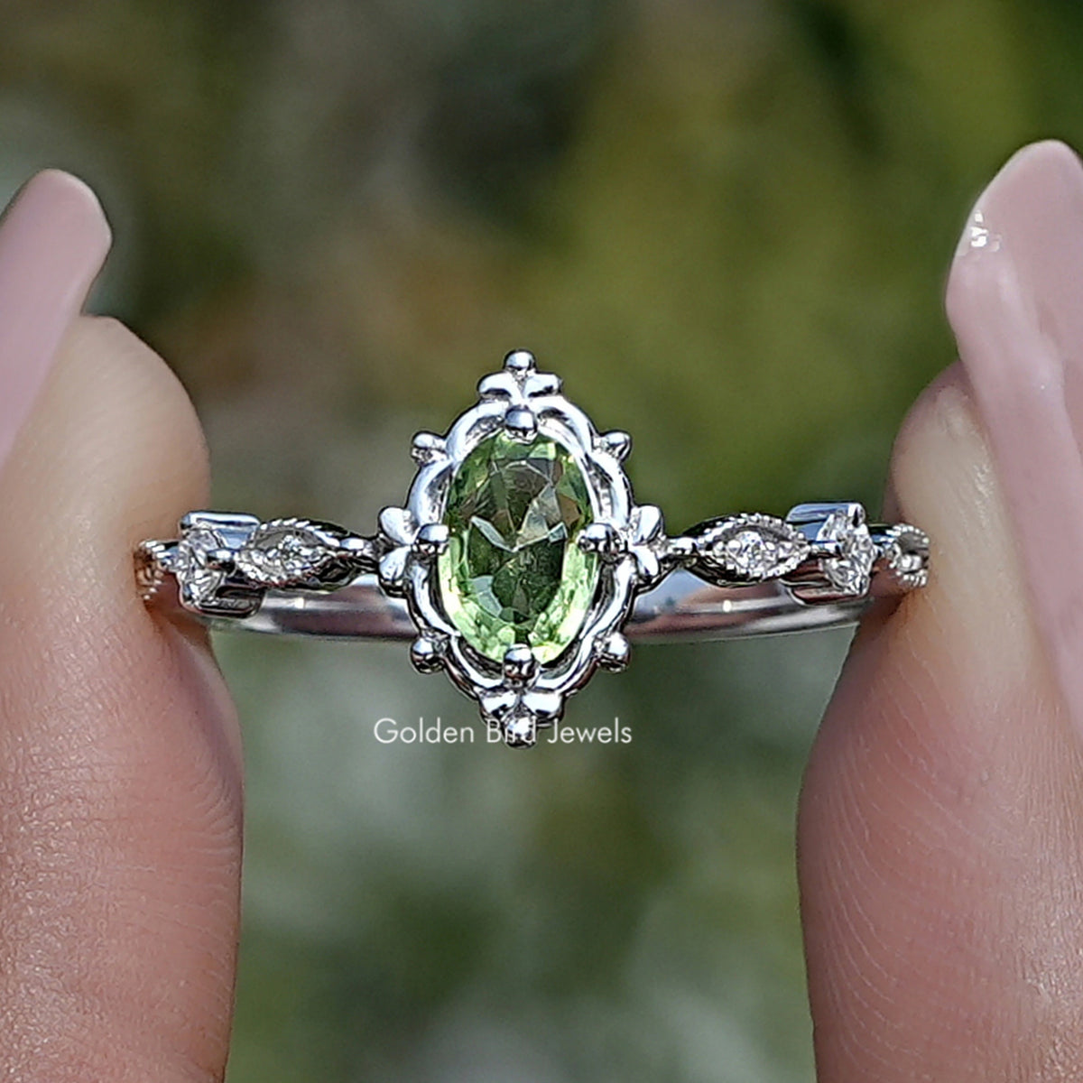 Peridot green oval gemstone accent ring in silver with marquise side details