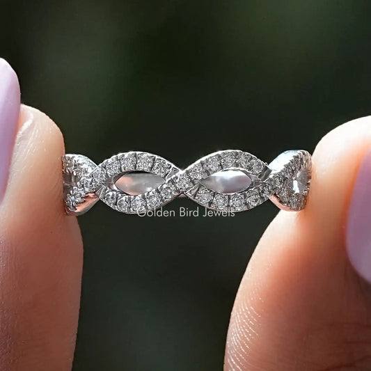 Moissanite infinity eternity band with pavé-set interlocking loops