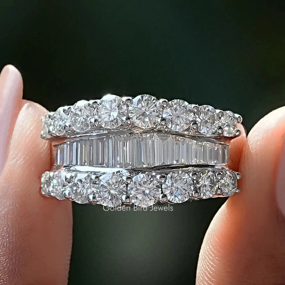 Silver eternity band with round and baguette moissanite stones, shared prong setting