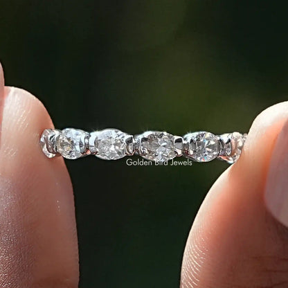Oval-cut moissanite eternity band with prong-set sparkling stones