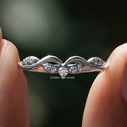 Curved silver wedding band ring with small round moissanite stones on raised arcs