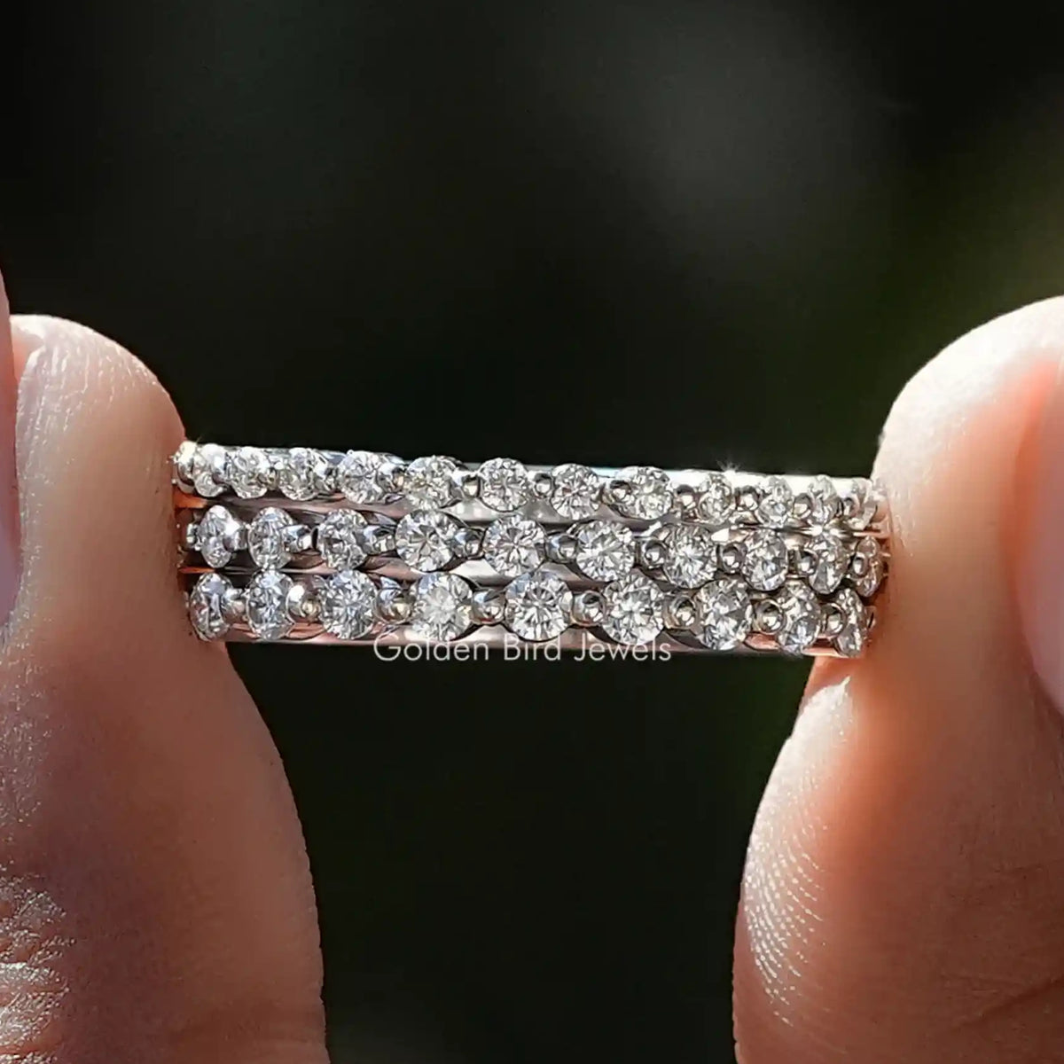 Silver round-cut moissanite eternity band with clear pave stones, stackable two-row style