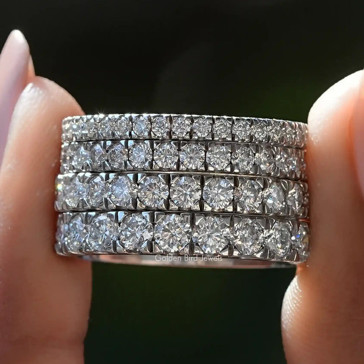 Silver half eternity wedding band with round-cut moissanite stones in two rows