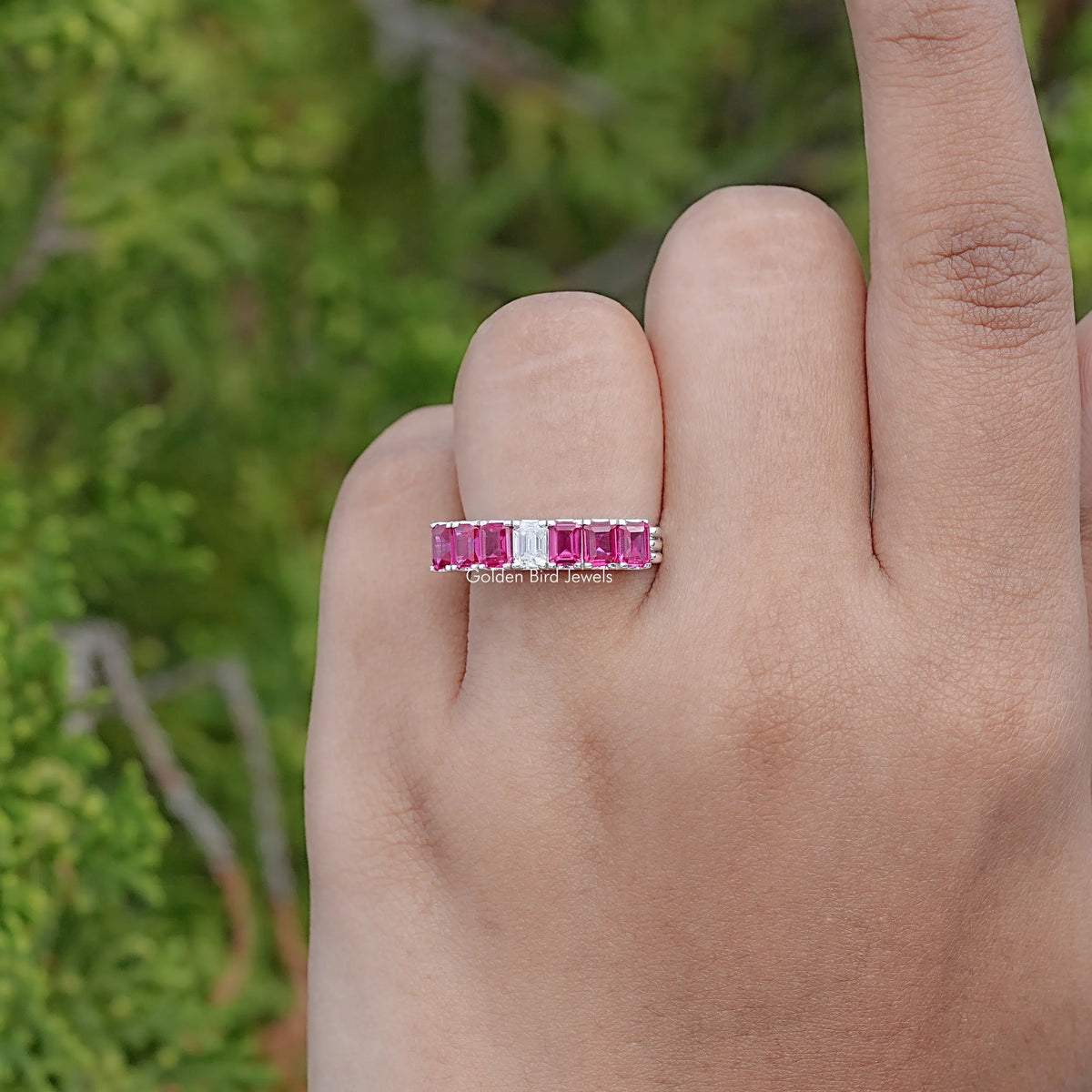 Top View Of Red Ruby Emerald Shaped Gemstone Seven Stone Band
