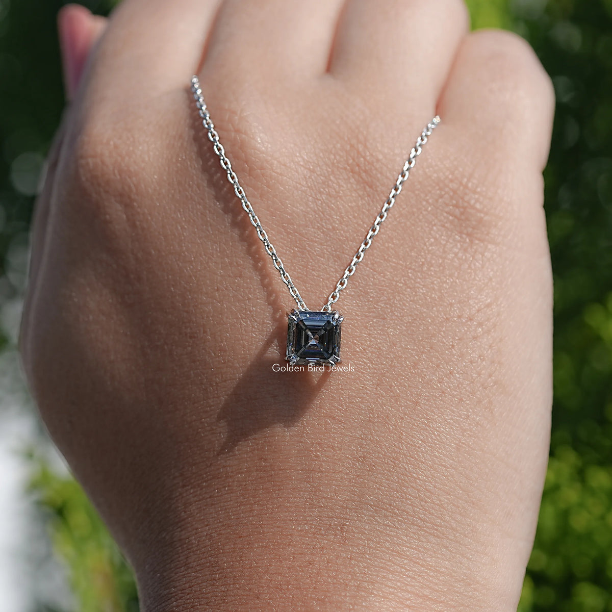 hand Showing View of Asscher Cut Moissanite Pendant
