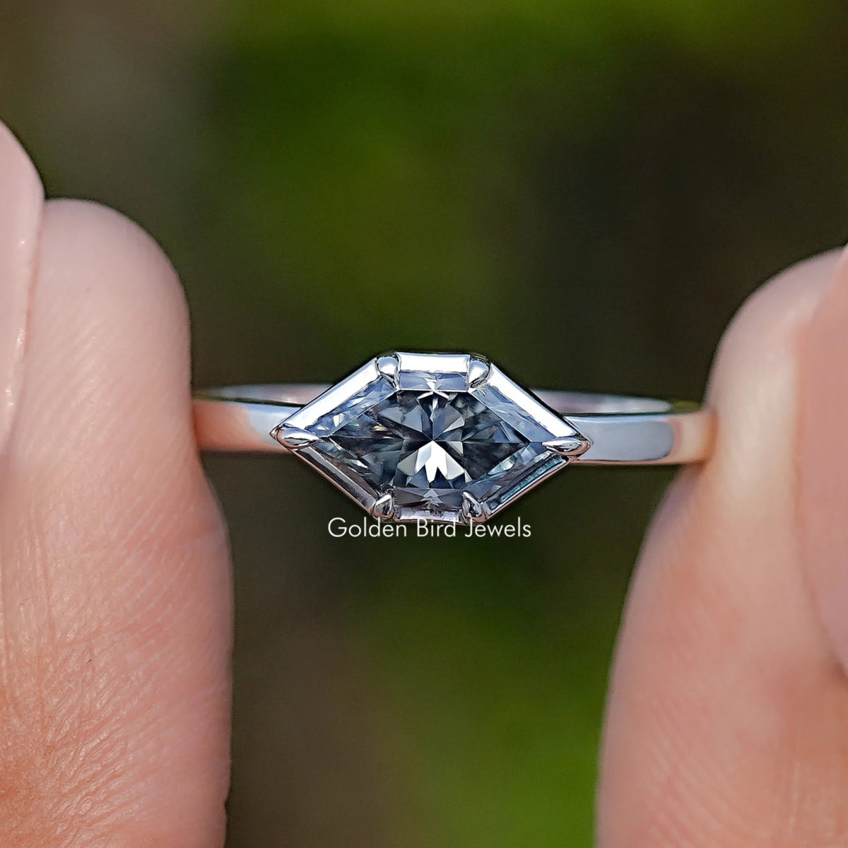 Marquise-cut gray moissanite solitaire ring with silver band and four-prong setting