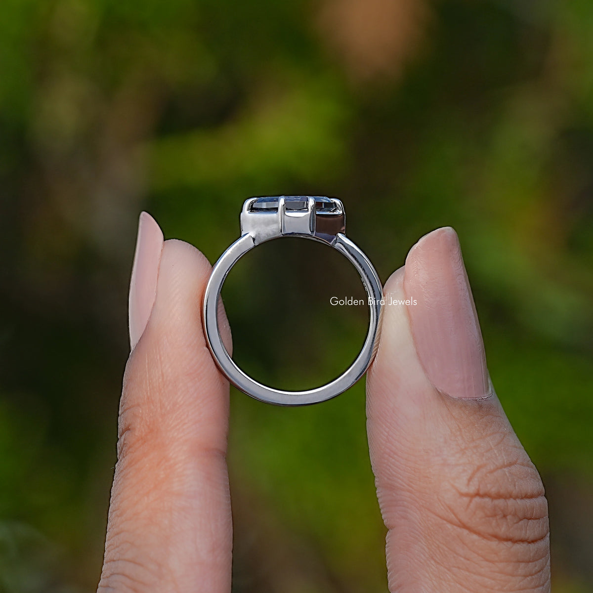 Silver marquise solitaire ring, rear view with open band and box prongs