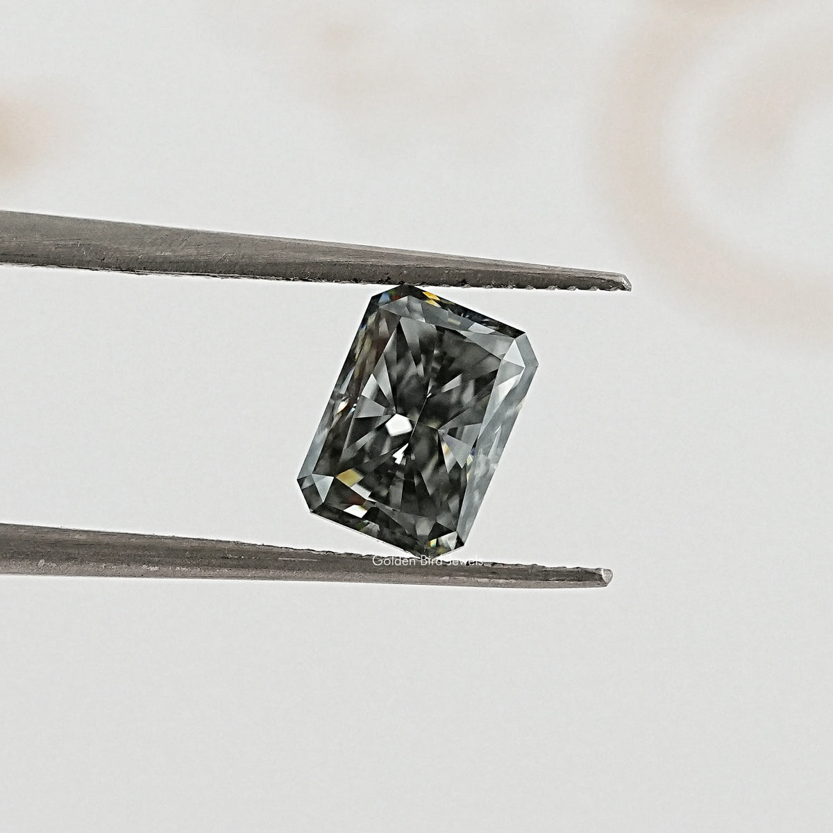 tweezers  View of Radiant Cut loose Moissanite for Anniversary Rings