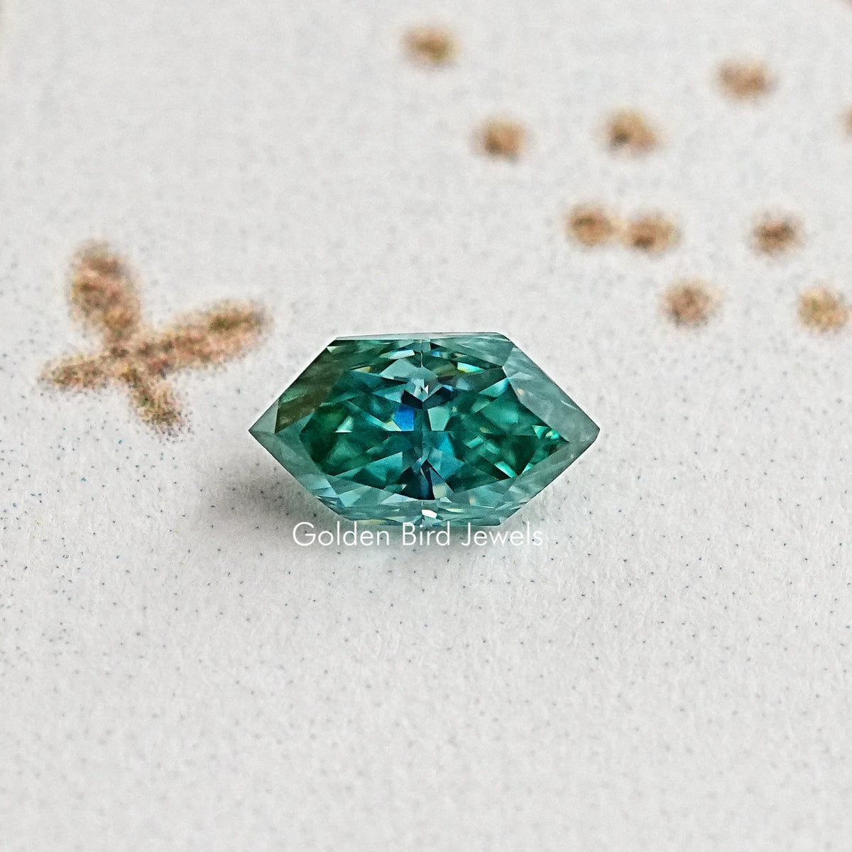 Marquise-cut blue-green moissanite gemstone, vivid teal center facets
