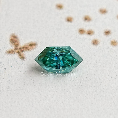 Marquise-cut blue-green moissanite gemstone, vivid teal center facets