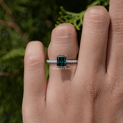 Sterling silver band ring with small accent stones and green moissanite square top