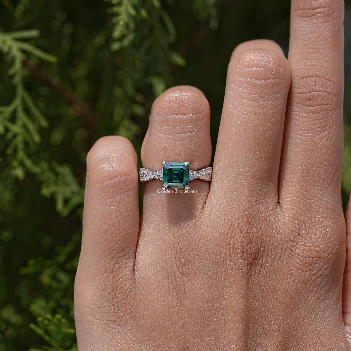 925 sterling silver moissanite ring with emerald-cut center stone and twisted pave detail