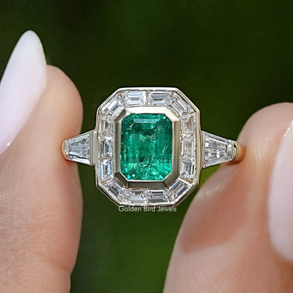 Sterling silver halo engagement ring with emerald-green square center and side baguette accents
