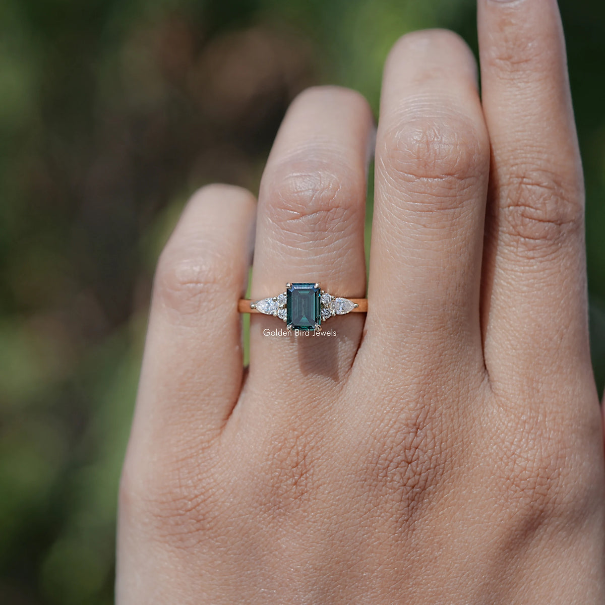 Top View Of Green Emerald Moissanite Engagement Ring in prongs setting 