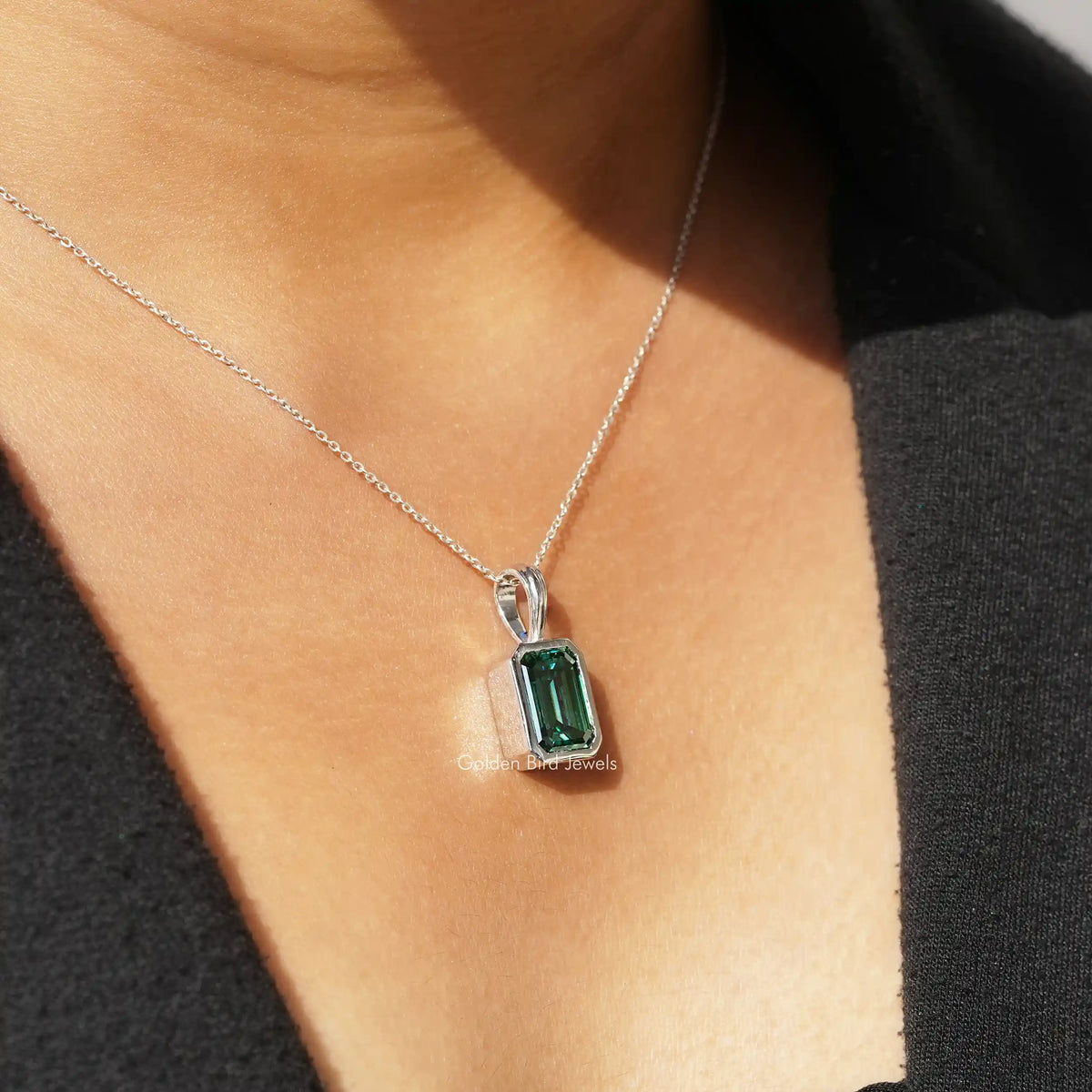 In front view of moissanite emerald cut pendant