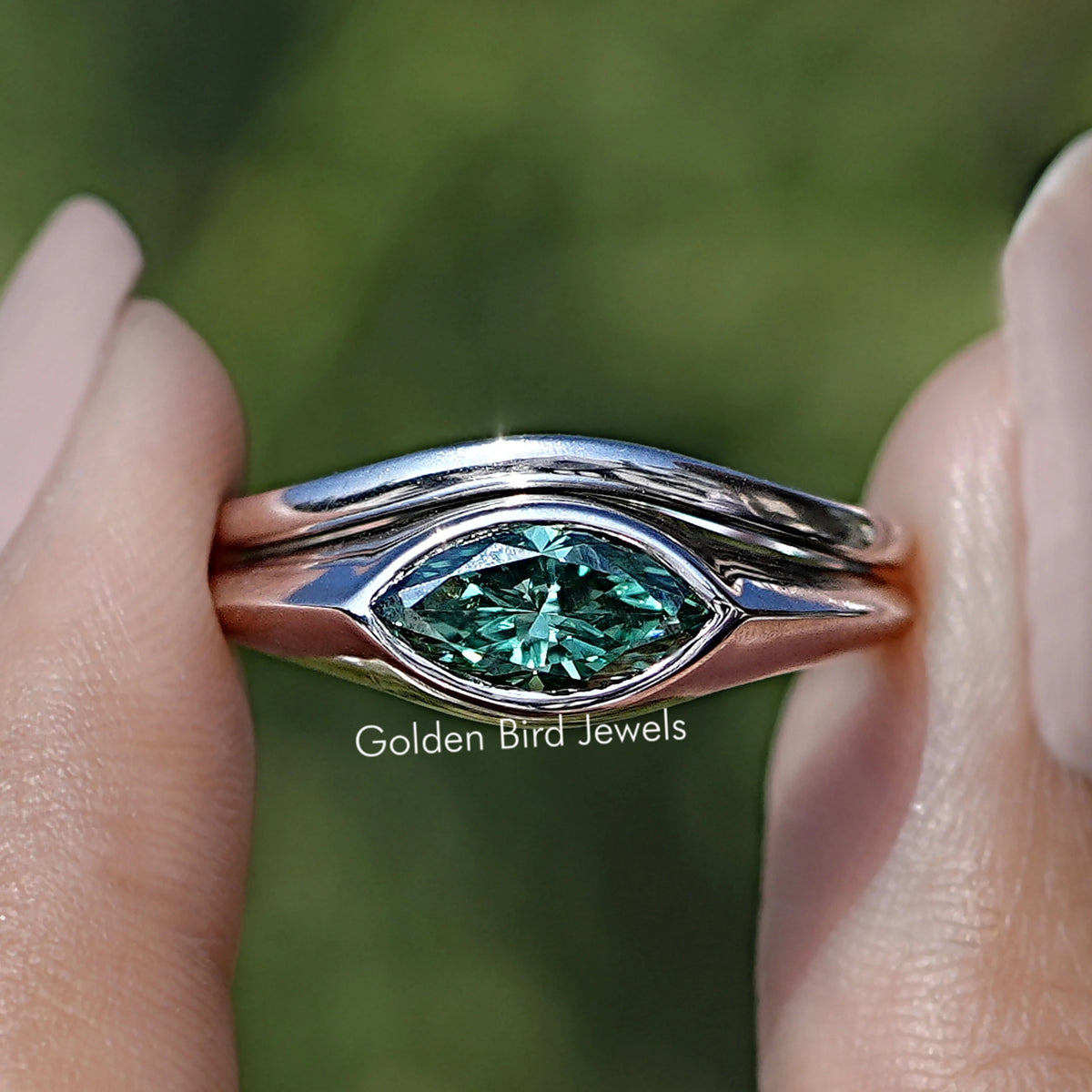 Front view of Green Marquise Bezel Set Moissanite Ring
