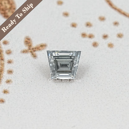 Gray trapezoid-cut moissanite gemstone featuring stacked rectangular facet cuts
