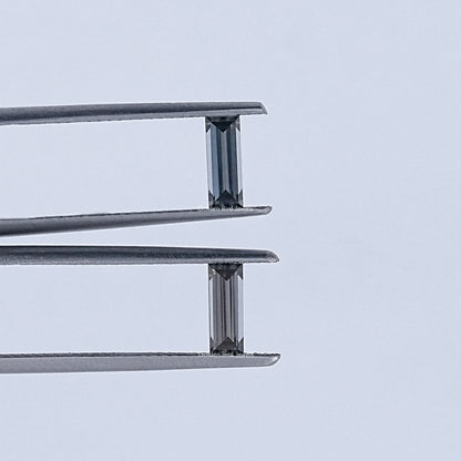 In Tweezer View Of Grey Baguette Cut Loose Moissanite Pair