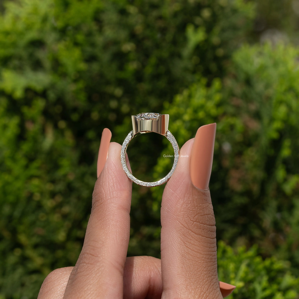 925 sterling silver oval moissanite solitaire with oval halo, shown front on finger