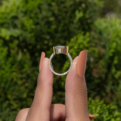 925 sterling silver oval moissanite solitaire with oval halo, shown front on finger