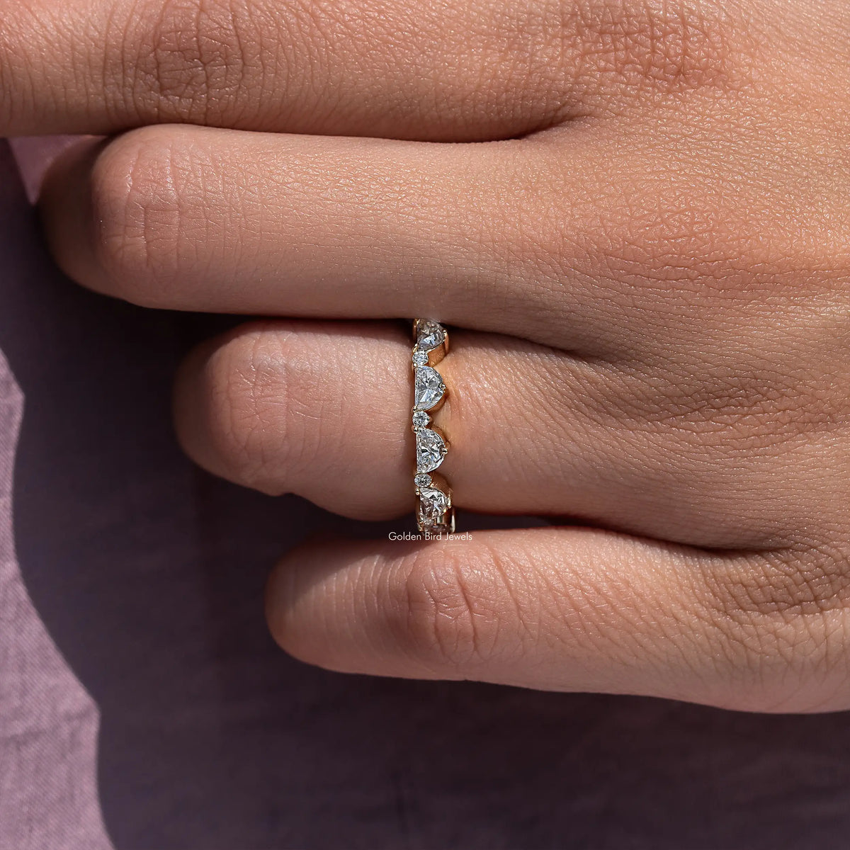 Diamond full eternity band ring, close-up of the stone row on the finger side