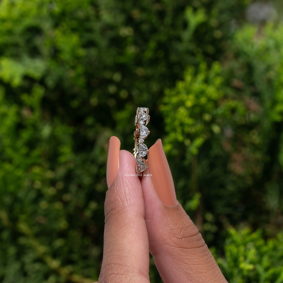 Diamond full eternity band ring held upright, showing tall vertical stone row