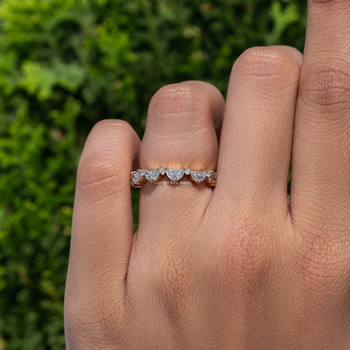 Diamond full eternity band ring with prong-set stones, worn on finger