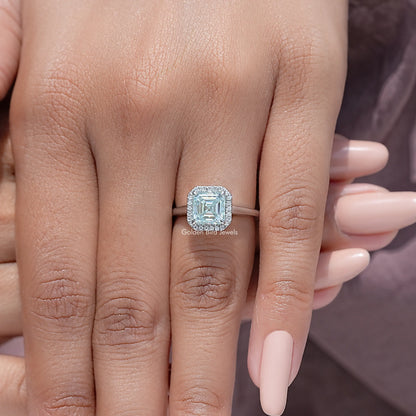 Asscher cut moissanite halo wedding ring close-up on hand, square stone setting