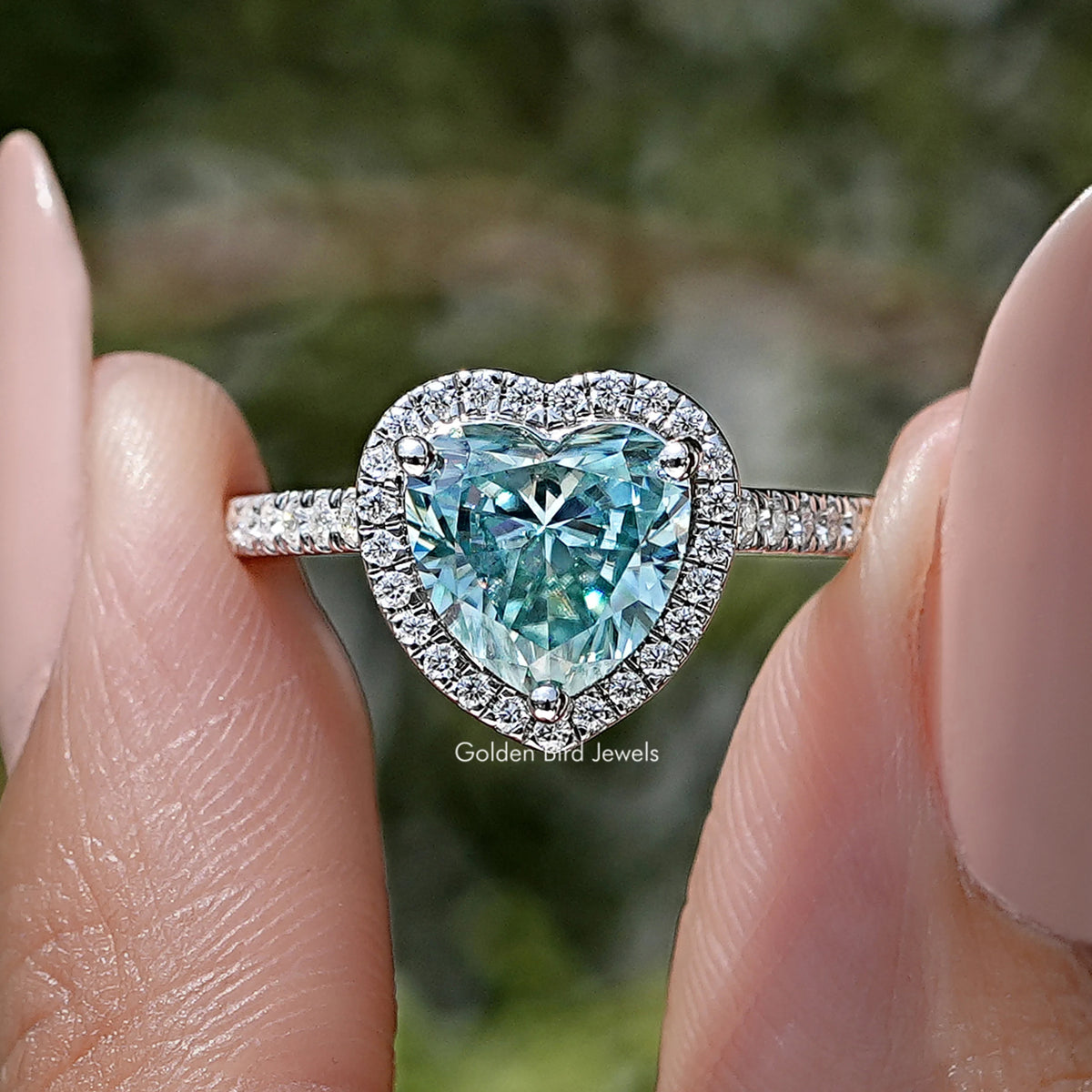 Heart-shaped blue gemstone halo wedding ring in sterling silver, front view