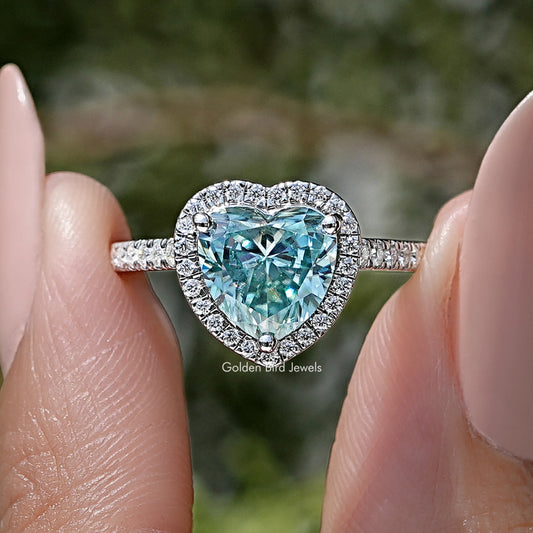 Heart-shaped blue gemstone halo wedding ring in sterling silver, front view