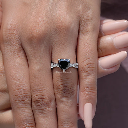 Black heart moissanite twisted accent band on a hand